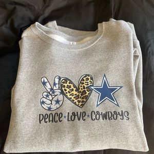 Woman’s peace love cowboys crew neck